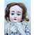 Bambola con testa in bisquit  e corpo in cartapesta.Abito finemente  ricamato..Firma DEP ,ferro di cavallo(Heuback) .1900.Germania.