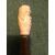 Stick with ivory knob depicting male figure with hat and pipe.     