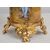 Coppia di vasi portafiori Napoleone III Francese in porcellana policroma poggiante su basi in bronzo dorato. Periodo XIX secolo.