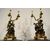 Coppia di candelieri in bronzo dorato e patinato raffiguranti baccanale di satiri, montati a lampada. Francia XIX secolo