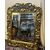 Specchiera del Sud America in oro zecchino intagliata a mano, epoca XIX secolo. Misure h 155 x  larg.115 cm.