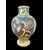Vaso in maiolica globulare con ovale raffigurante un angelo e decoro con motivi a trofei. Burgio,Sicilia.