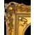 Cornice da Cristo in legno intagliato e foglia oro con applicazioni in stucco con decori floreali e putti.