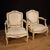 Painted and gilded armchairs in Louis XV style from the 20th century