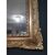 Piccola specchiera italiana del 1800 in legno dorato ed intagliato