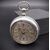 Orologio da tasca inglese in argento con splendido quadrante sbalzato, 1882. 