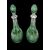 Coppie di bottiglie in cristallo verde molato con collo in argento.