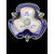 Centrotavola trilobato in maiolica policroma con decoro istoriato e manici a forma di serpente.Ginori