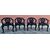 Quattro poltrone a 3 gambe orientali