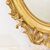 SPECCHIO ANTICO OVALE CON CIMASA, FIORI E VOLUTE, SPECCHIERA  ANTICA, CORNICE DORATA, DEL XIX SECOLO. (SPO171)