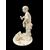 Scultura okimono in avorio raffigurante personaggio maschile con treccia e cesto.Giappone.