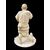Scultura okimono in avorio raffigurante personaggio maschile con treccia e cesto.Giappone.