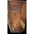 Credenza a sezione esagonale con due sportelli in legno di castagno e motivi geometrici.