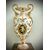 Grande vaso in maiolica con manico a draghi e decoro a raffaellesche e grottesche con putto  in medaglione centrale.Manifattura Ginori.