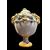 Vaso in maiolica con motivo a tralci d’una in rilievo,prese a forma di testa di ariete e coperchio con presa a forma di limone.manifattura Dallari,Sassuolo. 