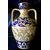Two-handled vase in majolica with gold luster decorated with stylized plant motifs.Ginori.     