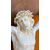 Cristo in avorio su cornice in legno intagliato.
