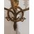 Coppia di appliques a tre luci in bronzo dorato