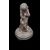 Piccola scultura in bronzo raffigurante un putto che suona il flauto.