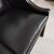 Coppia di poltrone inglese bergere in pelle nera del XX secolo 