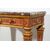 Consolle in legno scolpito, dorato e laccato a fondo rosso, piano in marmo 
