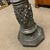Antica colonna primi 900 dipinta  a bronzo con rilievi a scena classica e personaggi .   Mis h 90 