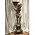 Scultura lignea argentata raffigurante un putto.