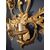 Grande applique in legno dorato intagliato