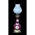 Lampada in porcellana con decoro floreale.