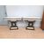 Coppia di consolle art deco in legno nero e pergamena con decori a bassorilievo