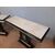 Coppia di consolle art deco in legno nero e pergamena con decori a bassorilievo
