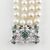 Bracciale in oro bianco con smeraldi e perle