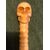 All ivory stick made up of segments. Knob depicting a skull.     