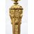 Coppia di candelieri antichi in bronzo dorato. Francia XIX secolo.