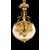 Lampada da tavolo in bronzo dorato a cinque fuochi.