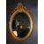 Specchiera ovale orizzontale francese del 1800 stile Luigi XV dorata foglia oro