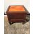 Mahogany bedside cabinet with leather-covered lifting top.     
