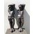 Coppia di fregi-sculture in legno di noce con figure maschili.