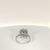 Anello in oro bianco con diamante centrale taglio smeraldo e diamanti