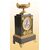 Orologio francese del 1800 stile Impero in metallo e bronzo dorato