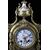 Tris composto da orologio e due candelabri francesi del 1800 meccati con quadrante in porcellana di Sevres