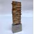 ARNALDO POMODORO, scultura "STELE", firmata in bronzo argentato, 1977