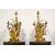  Coppia di grandi candelabri a tre luci in bronzo dorato con aironi e fiori in porcellana policroma, Francia, XIX secolo