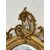 Specchiera caminiera lignea intagliata dorata . XIX secolo. Restaurata
