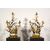  Coppia di grandi candelabri a tre luci in bronzo dorato con aironi e fiori in porcellana policroma, Francia, XIX secolo