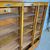 Antica serrandina / libreria  anni 50 tre ante in faggio massello .  modernariato restaurata 18 ripiani . Mis 148 x 39
