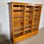 Antica serrandina / libreria  anni 50 tre ante in faggio massello .  modernariato restaurata 18 ripiani . Mis 148 x 39