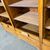Antica serrandina / libreria  anni 50 tre ante in faggio massello .  modernariato restaurata 18 ripiani . Mis 148 x 39