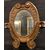 SPECC558 - Oval lacquered and gilded mirror, '7/'800 period, measures cm W 105 x H 207