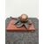 Pear-shaped bronze inkwell on marble base.     